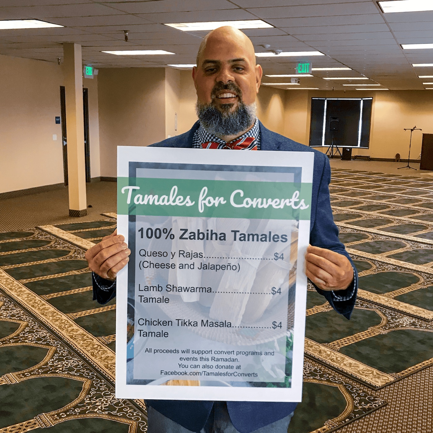 Imam Marc Manley with a Tamales for Converts fundraiser sign